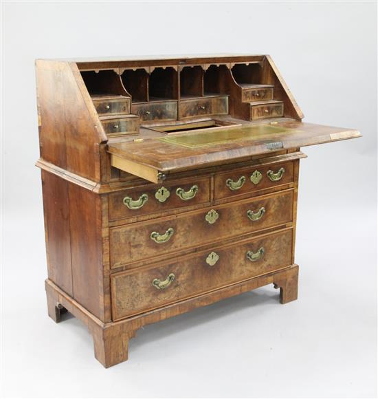 An early 18th century featherbanded walnut bureau, W.3ft 2in.